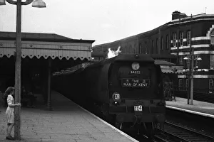 Young girl watches arrival of steam train Young girl watches arrival of steam train