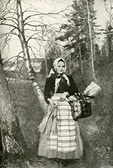 Young peasant woman in a wood, Finland Young peasant woman in a wood, Finland