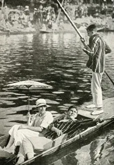 Three young people punting on a river, England Three young people punting on a river, England