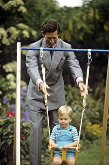 Young Prince william on a swing, pushed by Prince Charles Young Prince william on a swing, pushed by Prince Charles
