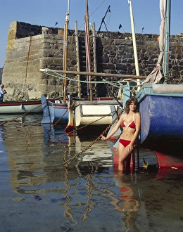 Young woman in bikini, Coverack, Cornwall Young woman in bikini, Coverack, Cornwall