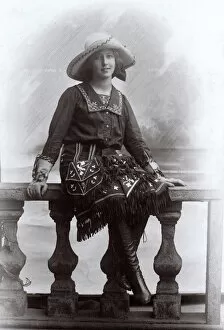 Tassels Gallery: Young woman in a studio photo, wearing fancy dress