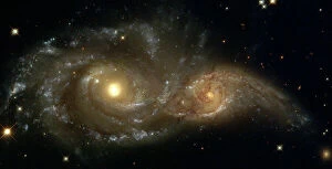 Hubble Space Telescope Gallery: A Grazing Encounter Between Two Spiral Galaxies