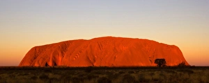 Ayers Rock - Uluru - brightly ablaze Ayers Rock shortly at sunset Ayers Rock - Uluru - brightly ablaze Ayers Rock shortly at sunset