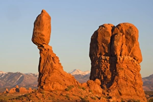 Balanced rock - sandstone rock formation in the shape of a spire with an oval shaped rock Balanced rock - sandstone rock formation in the shape of a spire with an oval shaped rock