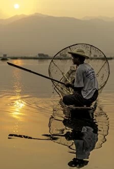 Images Dated 1st April 2013: Burmese Fisherman fishing at dawn