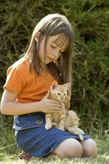 Images Dated 18th June 2005: Cat - girl holding ginger kitten