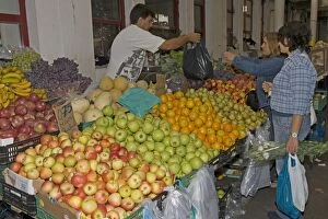 Cusomers buying fruit in market at Vila do Conde