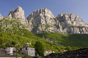 The dramatic limestone cliffs of Astraka mountain, towering above Micro Papingo village The dramatic limestone cliffs of Astraka mountain, towering above Micro Papingo village