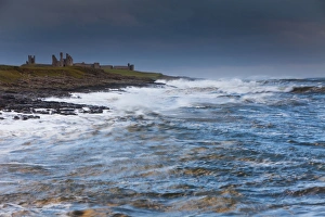 Dunstanburgh Castle - stormy North Sea - autumn Dunstanburgh Castle - stormy North Sea - autumn
