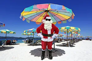 Father Christmas / Santa Claus on beach, Khai Nai Island, Phuket, Thailand Date: 21-Jun-12 Father Christmas / Santa Claus on beach, Khai Nai Island, Phuket, Thailand Date: 21-Jun-12