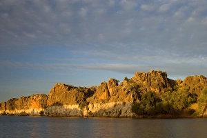 Geike Gorge - beautiful red cliffs of Geike Gorge and clouds in last evening light Geike Gorge - beautiful red cliffs of Geike Gorge and clouds in last evening light