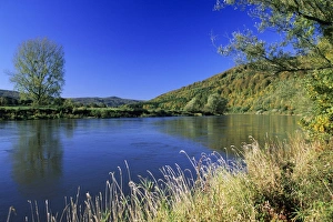 Germany - River Weser and surrounding forestry covered hills, early autumn Germany - River Weser and surrounding forestry covered hills, early autumn