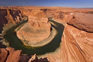 Horseshoe Bend - dramatic view of a nearly 360 degree bend of the Colorado river cut into Horseshoe Bend - dramatic view of a nearly 360 degree bend of the Colorado river cut into