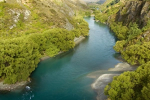 Kawarau river canyon - gorgeous Kawarau river flowing down deep canyon surrounded by Kawarau river canyon - gorgeous Kawarau river flowing down deep canyon surrounded by