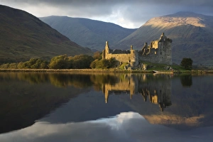 Kilchurn Castle in beautiful evening light reflected in Loch Awe - November Kilchurn Castle in beautiful evening light reflected in Loch Awe - November