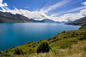 Lake Wakatipu - surrounded by stunning mountains with dispersing clouds after a heavy Lake Wakatipu - surrounded by stunning mountains with dispersing clouds after a heavy
