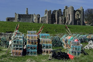 Lindisfarne, Holy Island - Lobster pots in front of monasty ruins Lindisfarne, Holy Island - Lobster pots in front of monasty ruins