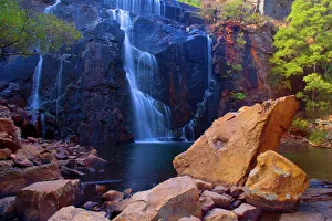 Mac Kenzie Falls - water cascades down red cliffs of Mac Kenzie Falls into a picturesque plunge pool surrounded by gum Mac Kenzie Falls - water cascades down red cliffs of Mac Kenzie Falls into a picturesque plunge pool surrounded by gum