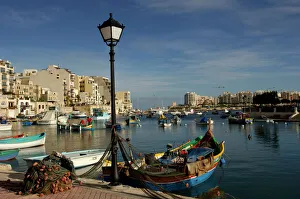 Malta - Spinola Bay - once a thriving fishing port, but in recent years tourism has taken Malta - Spinola Bay - once a thriving fishing port, but in recent years tourism has taken