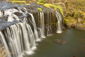 Millstream Falls - water cascades down a basalt cliff into a beautiful pool Millstream Falls - water cascades down a basalt cliff into a beautiful pool
