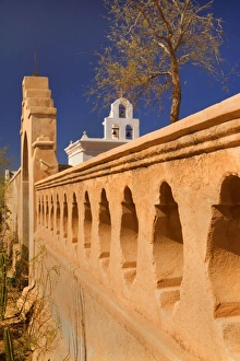 Mission San Xavier del Bac - beautiful archway, ornate wall and white bell tower of this famous mission in western style, near Tuscon Mission San Xavier del Bac - beautiful archway, ornate wall and white bell tower of this famous mission in western style, near Tuscon