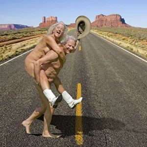 Naked couple wearing cowboy boots and hat crossing road in Monument Valley, Arizona Date: 27-03-2021 Naked couple wearing cowboy boots and hat crossing road in Monument Valley, Arizona Date: 27-03-2021