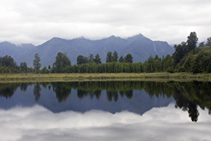 New Zealand - Reflections of southern alps in Lake Matheson New Zealand - Reflections of southern alps in Lake Matheson