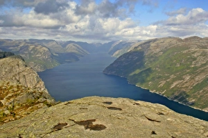 Preikestolen - view from rock pulpit Preikestolen down to Lysefjord and surrounding mountains Preikestolen - view from rock pulpit Preikestolen down to Lysefjord and surrounding mountains