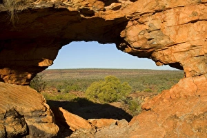 Keep River Rock formations - a window in the red rocks with a view toward the less Keep River Rock formations - a window in the red rocks with a view toward the less