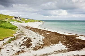 Sandy beach and croft on Berneray (Bearnaraigh), with the Sound of Harris beyond, Outer Hebrides, Scotland, UK