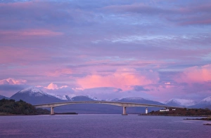 Skye bridge with the mountains of Skye covered in snow in the background on a beautiful Skye bridge with the mountains of Skye covered in snow in the background on a beautiful