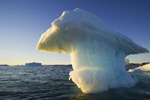 Drifting Gallery: Small iceberg drifting in Disko Bay, midnight
