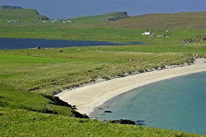 Summer beach - beach of Scousburgh Sands on the right and Loch Spiggie on the left Summer beach - beach of Scousburgh Sands on the right and Loch Spiggie on the left