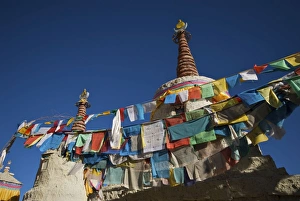 Tibet prayer flags on village stupa Tibet prayer flags on village stupa