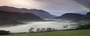 View from Castlerigg Stone Circle looking down the mist covered valley - November View from Castlerigg Stone Circle looking down the mist covered valley - November