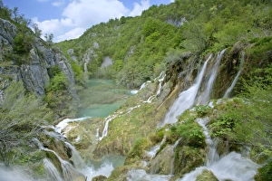 Waterfall - cascading down steep cliffs in lower canyon forming the korana river Waterfall - cascading down steep cliffs in lower canyon forming the korana river