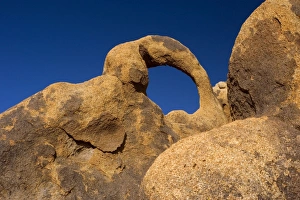 Whitney Portal Arch - amazing rock arch of red granite situated at the foothills of the Whitney Portal Arch - amazing rock arch of red granite situated at the foothills of the