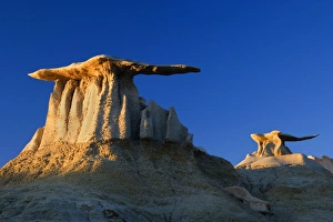 The Wings - eroded clay sculptures with rocks balanced on its tops that make it look like The Wings - eroded clay sculptures with rocks balanced on its tops that make it look like