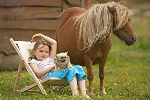 Images Dated 22nd July 2000: Young Girl - sitting in deckchair with dog and Shetland Pony