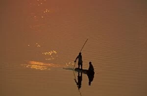 Zambia - Fishermen at sunset on the Luangwa river