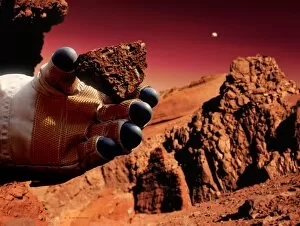 Images Dated 7th November 2003: Astronaut holds Martian rock