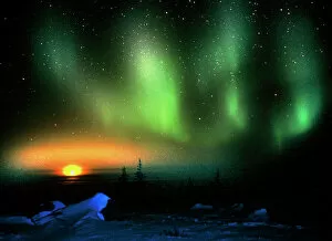 Earth Science Gallery: Aurora borealis display with setting Moon