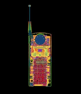 Images Dated 18th November 1997: Coloured X-ray of a mobile telephone