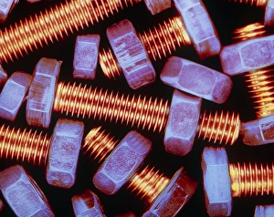 False-coloured photograph of nuts and bolts False-coloured photograph of nuts and bolts