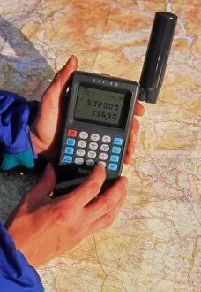 Images Dated 10th August 1993: Hand-held GPS receiver and map