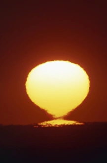 Image of a distorted Sun seen at sunset Image of a distorted Sun seen at sunset