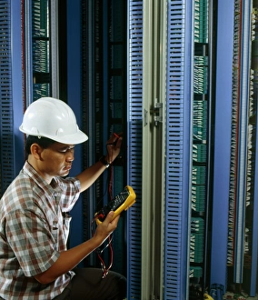 Images Dated 9th July 1996: Man testing circuit boards at telephone exchange