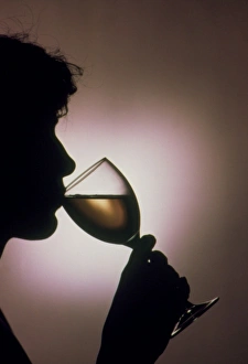 Images Dated 20th February 1991: Person drinking alcohol, silhouette