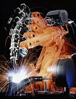 Images Dated 23rd September 1996: Robot arm spot-welding a car suspension unit
